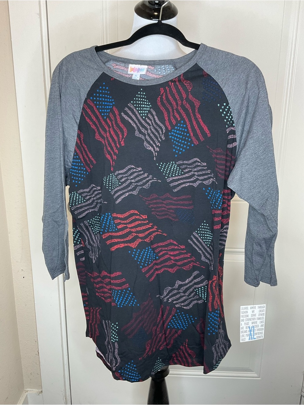 LuLaRoe Randy Black Baseball Tee with Gray Sleeves and Multicolor Flag Print XL